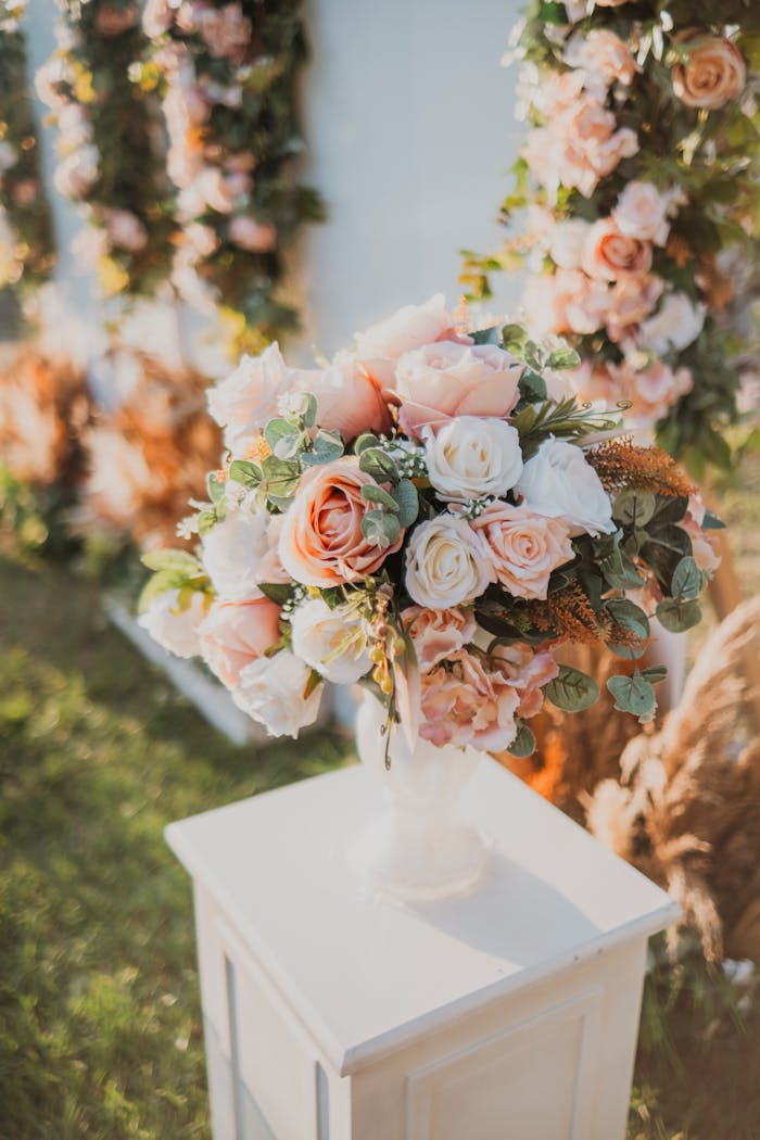 Beautiful bouquet of roses on a stand, perfect for wedding decor.